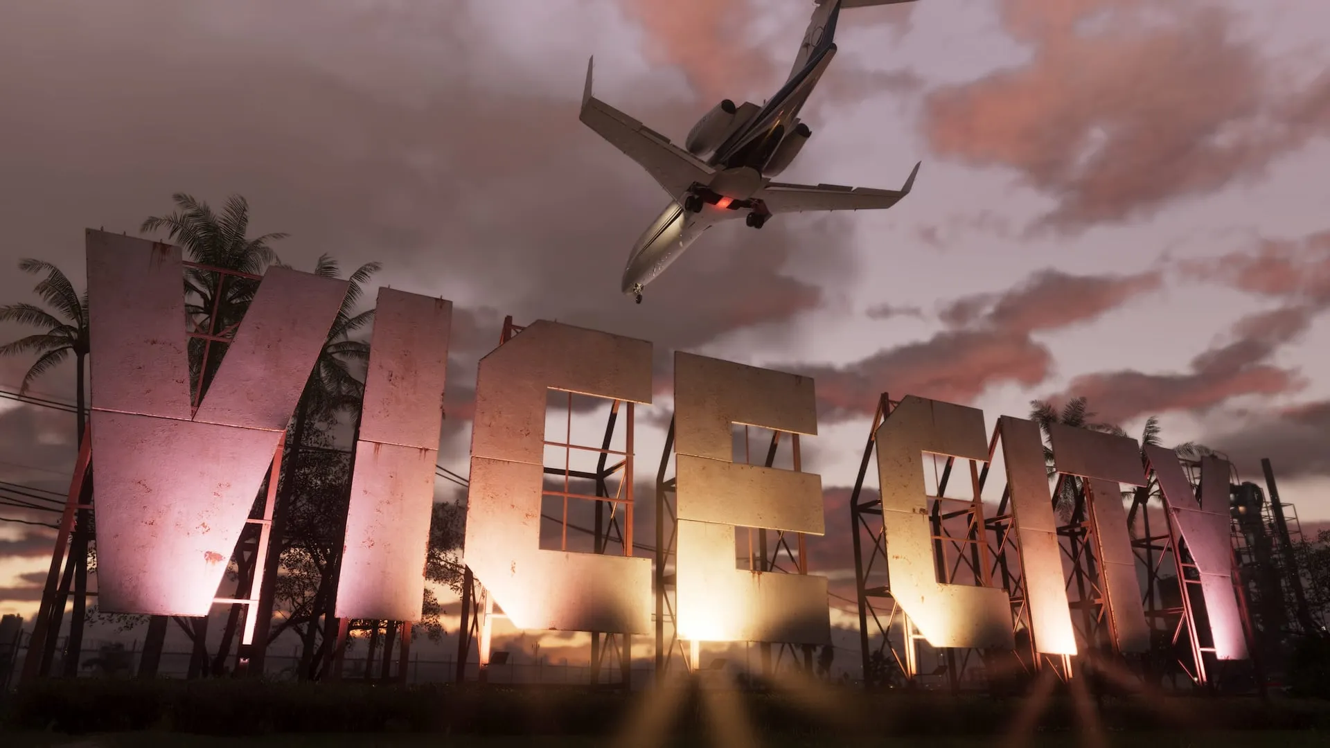 The Vice City sign at sunset with a plane flying low overhead, from Grand Theft Auto VI